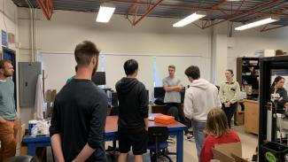 group conversation around a table in a lab