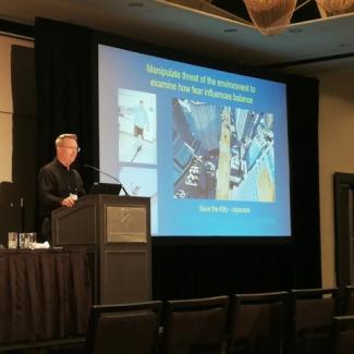 Mark Carpenter presenting at a podium